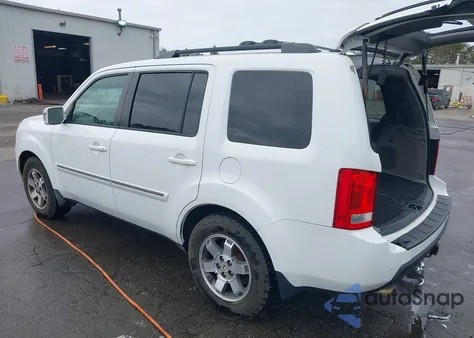 2009 Honda Pilot Touring z USA, uszkodzony, nr VIN 5FNYF48959B053187